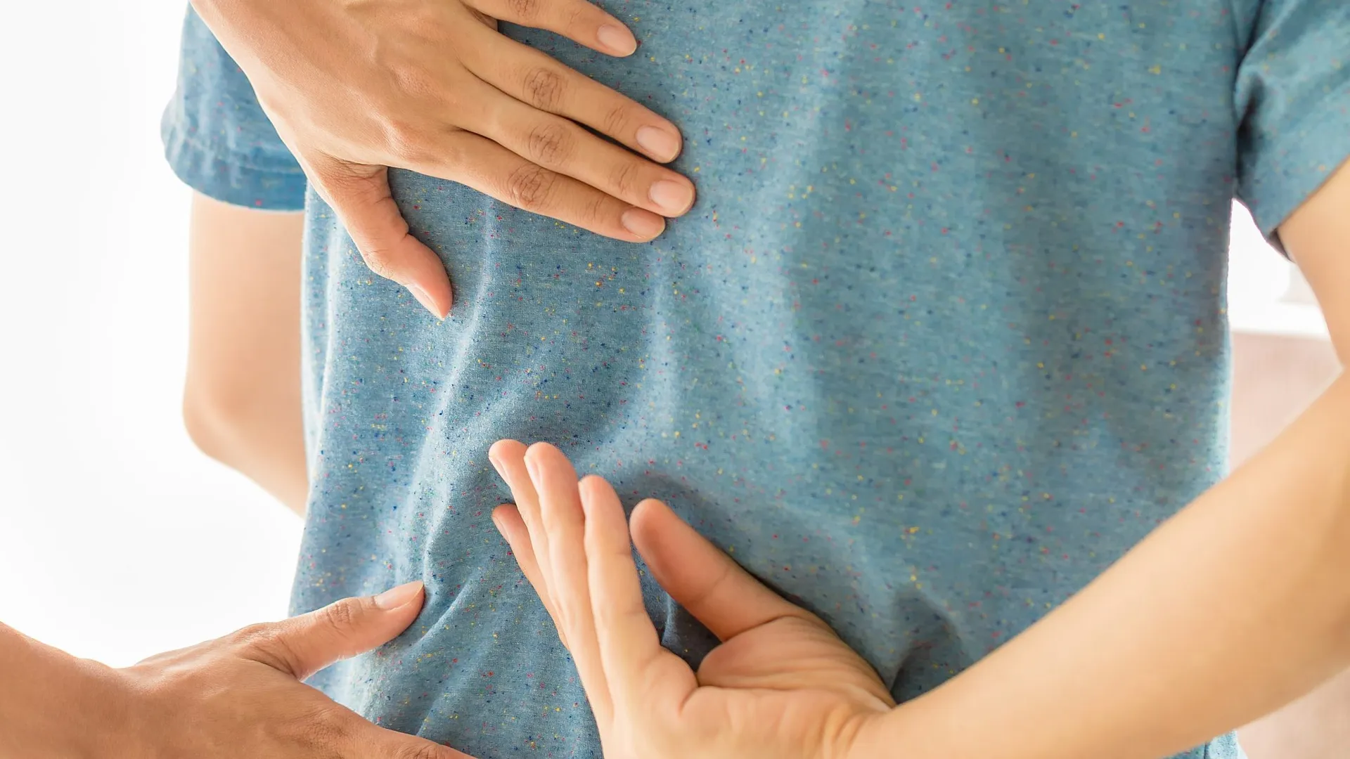 Physiotherapist treating a patient’s lower back