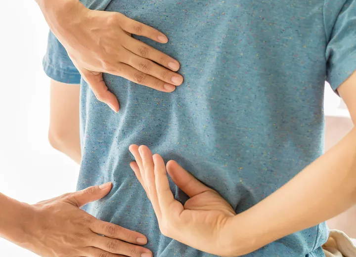 Physiotherapist treating a patient’s lower back